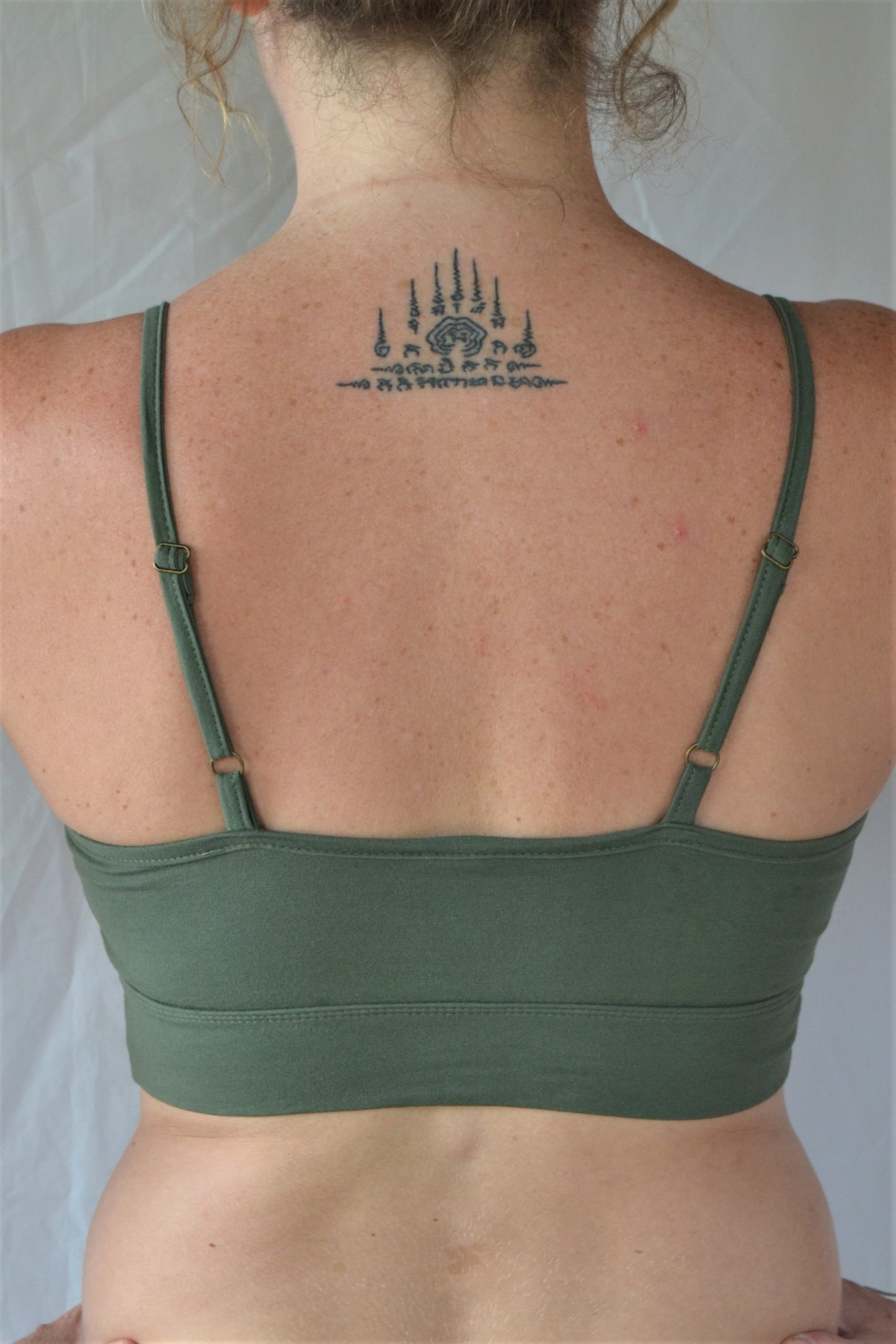 You'll be blissed out in this flattering Sage green bra with adjustable spaghetti straps and scrunched center puckering, it will soon become your new favorite!