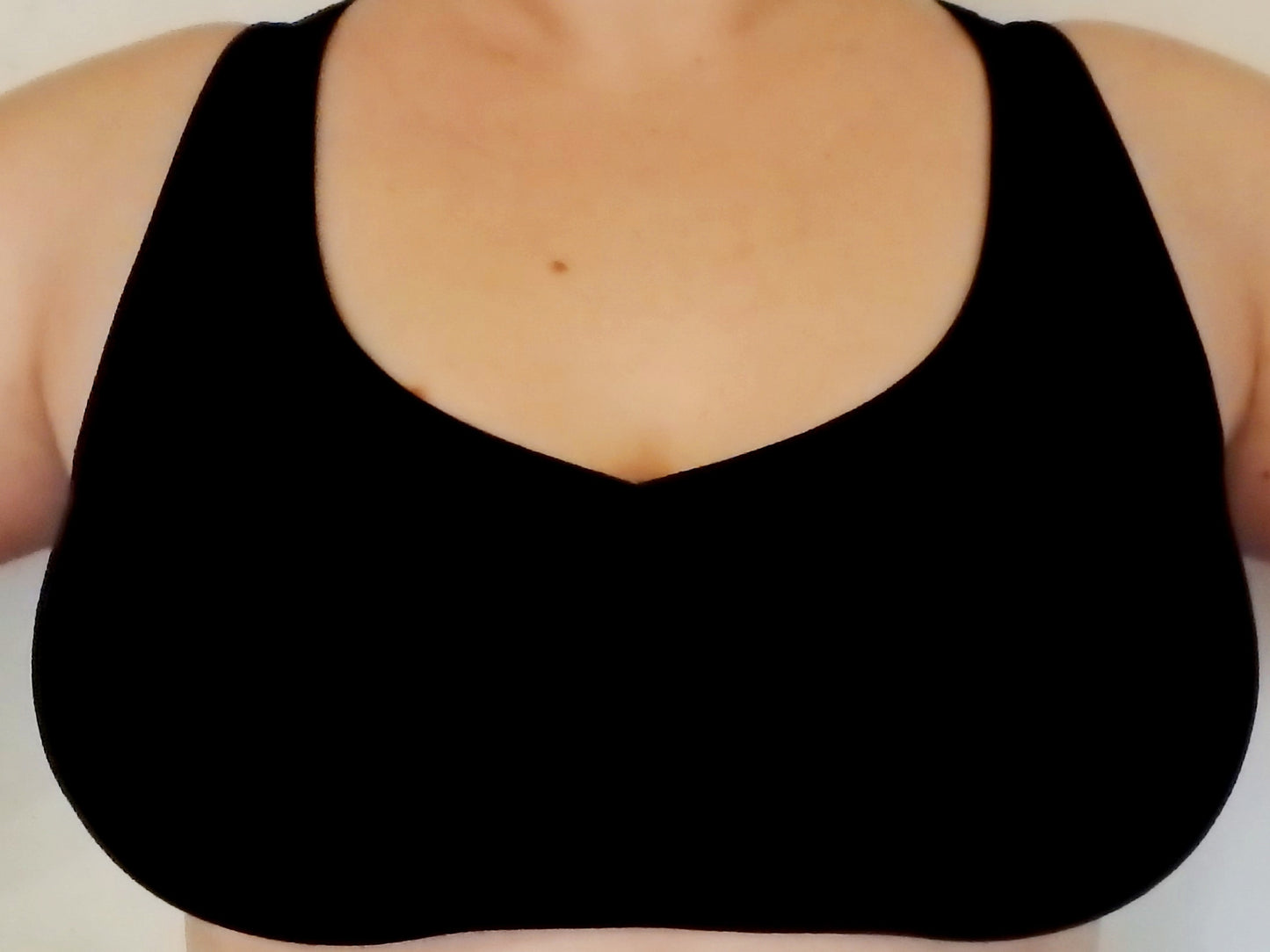 Onyx sports bra with heavy duty full coverage front for large breasted and fuller figured women. Has sunburst design in straps on back. Cute, comfortable and functional!