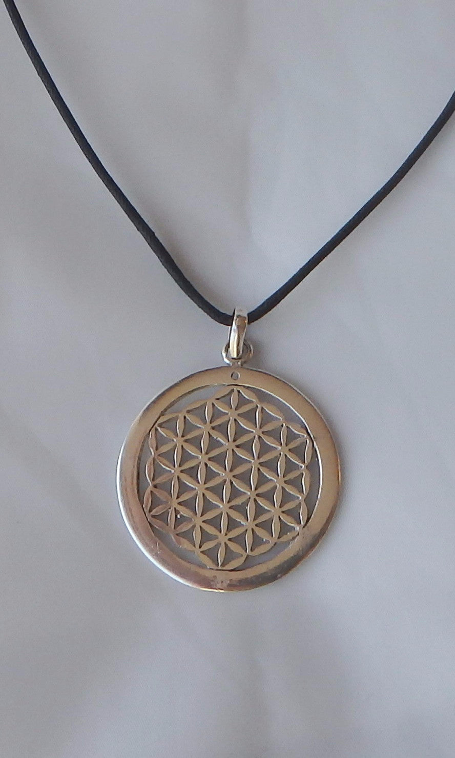 Silver Flower of Life Sacred Geometry pendent 3.5 cm (almost 1.5") in diameter, comes on black waxed cotton cord (vegan friendly).