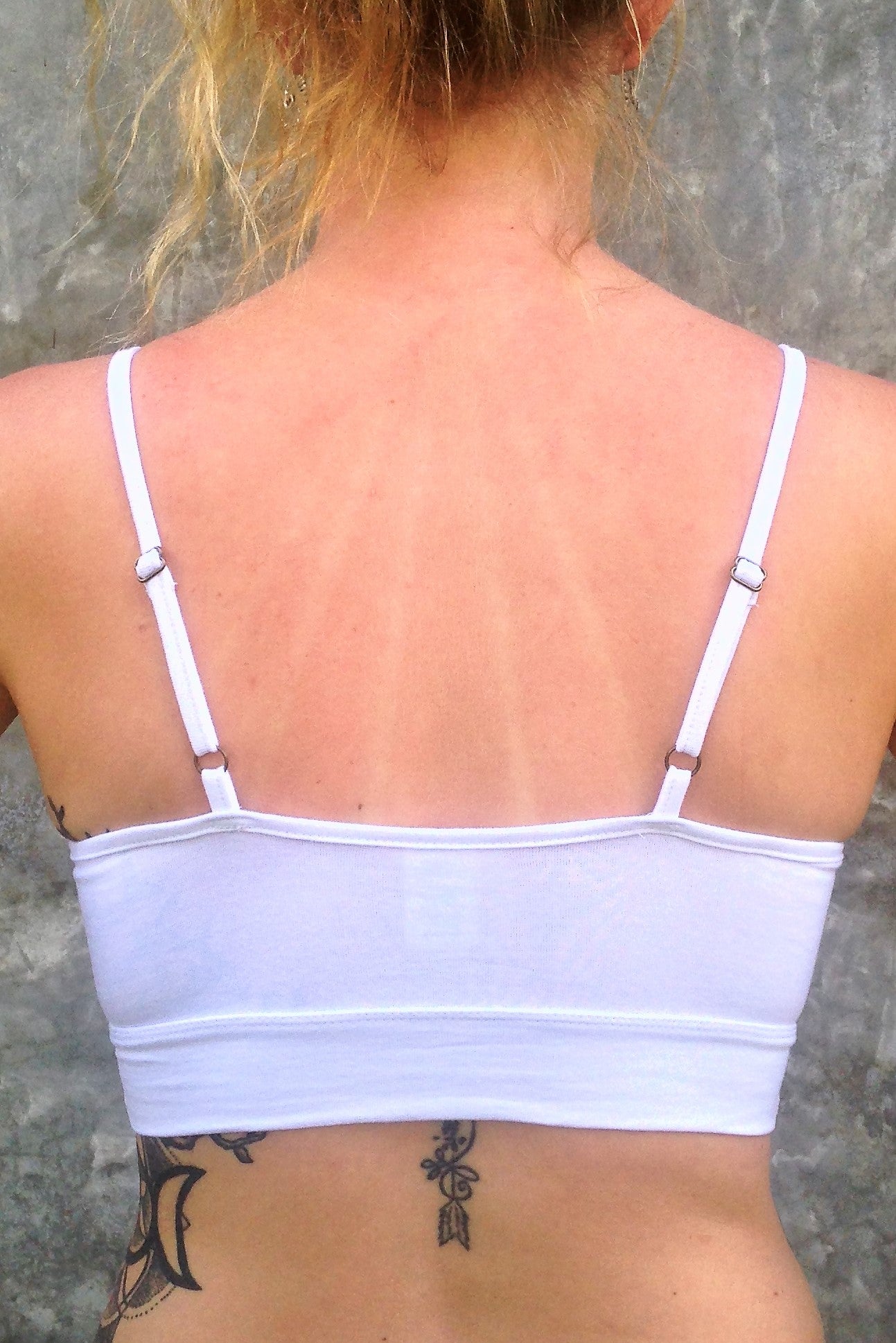 Back view of flattering white bra with adjustable spaghetti straps.