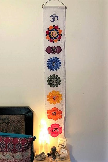 Vertical wall art Batik with 7 Chakra Symbols in rainbow on white background. 100% rayon fabric ethically hand made.