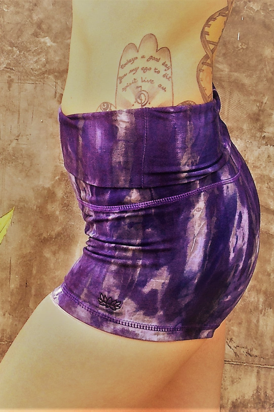 Comfortable, flattering high quality 90% Organic Cotton with 10% spandex knit into soft stretchy yoga shorts with fold over top for adjustable fit can be worn with higher waist or lower on the hips. Gorgeous cool purple hues with grey and possibly white highlights and small lotus flower embroidery on side.