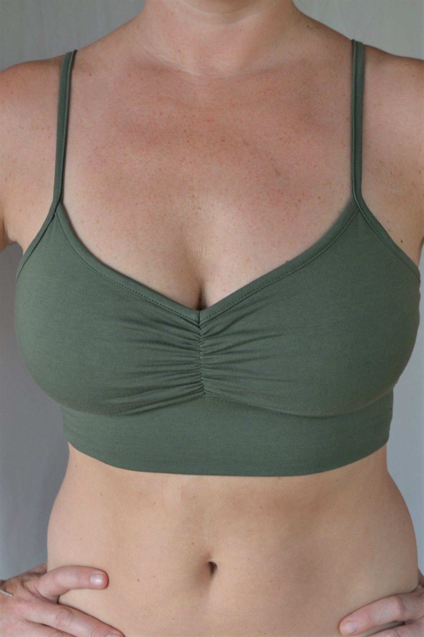 You'll be blissed out in this flattering Sage green bra with adjustable spaghetti straps and scrunched center puckering, it will soon become your new favorite!