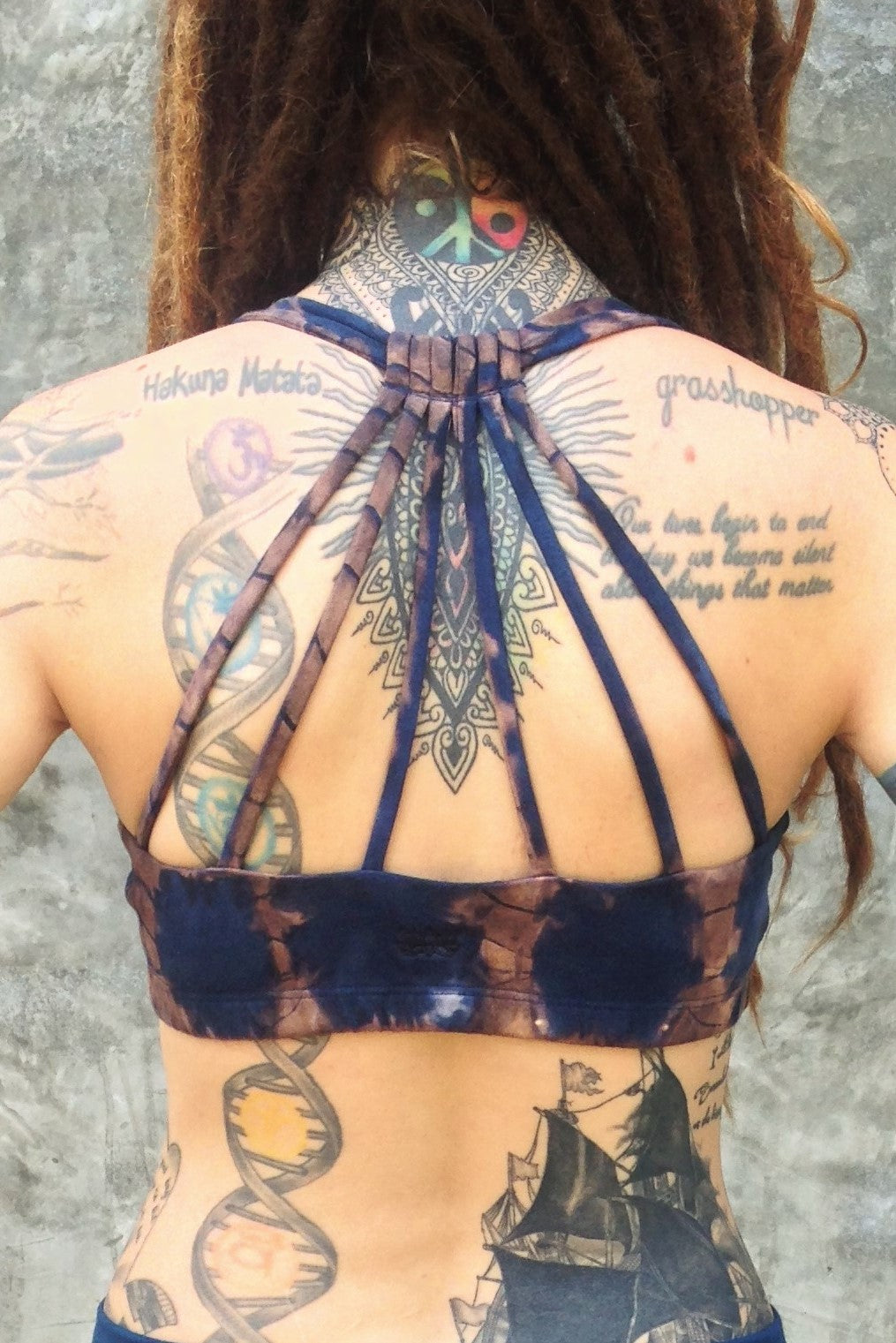 Gorgeous back strap pattern of Shakti Sportbra in Indigo Earth shown. Small lotus flower embroidery on back. Made for 90% Organic Cotton with 10% spandex. 