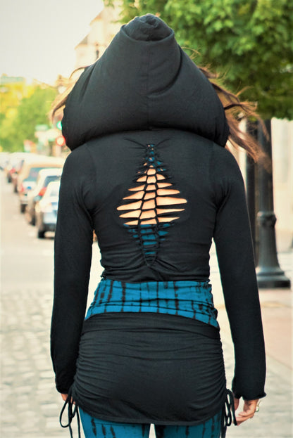 Back view of Long Sleeve Onyx Ninja Jacket Wrap. Comes with oversized hood and see thru detail on back. Soft and silky, perfect for layering over a sportbra after yoga class or as streetwear 