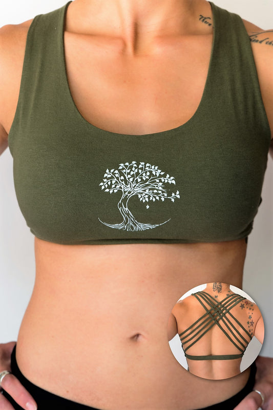 Sage sports bra with silver bodhi tree design on front, has 4 criss cross straps on back with enough support for down dog or other yoga poses. 