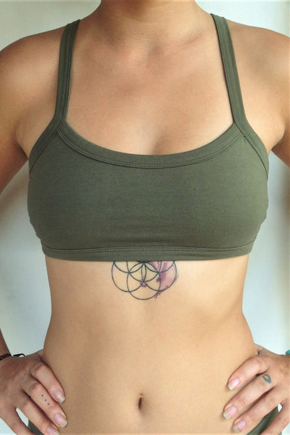 Front view of Trinity Sportsbra has solid Sage green front. One of the most comfortable sports bras you will ever wear, soft and super cute with 3 horizontal straps across back. Medium support.